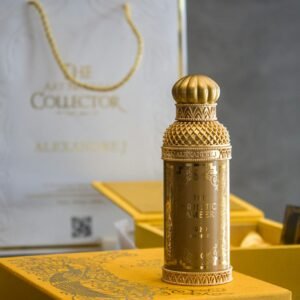 Elegant gold perfume bottle displayed with luxurious packaging, showcasing design details.
