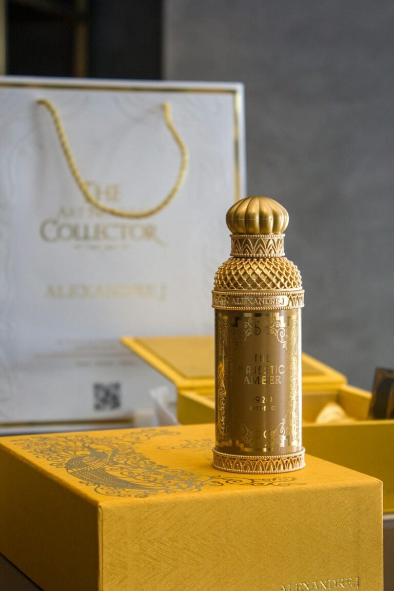 Elegant gold perfume bottle displayed with luxurious packaging, showcasing design details.